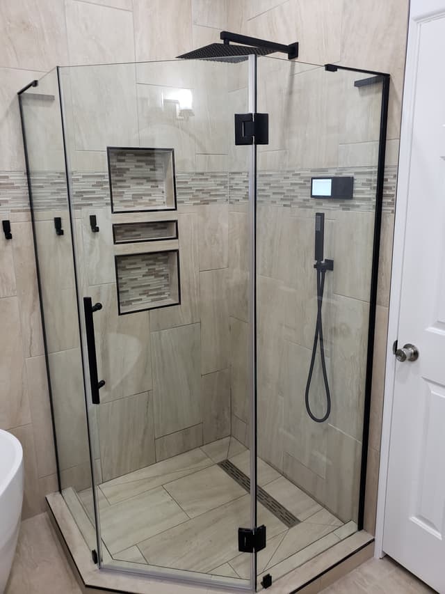Custom shower with large format tile and glass doors