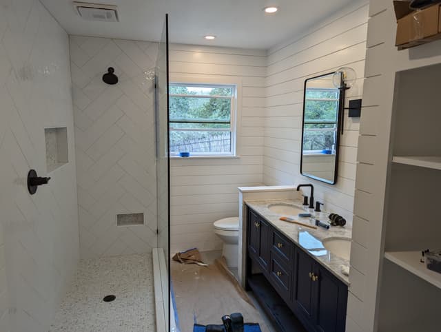Farmhouse bathroom renovation with shiplap walls