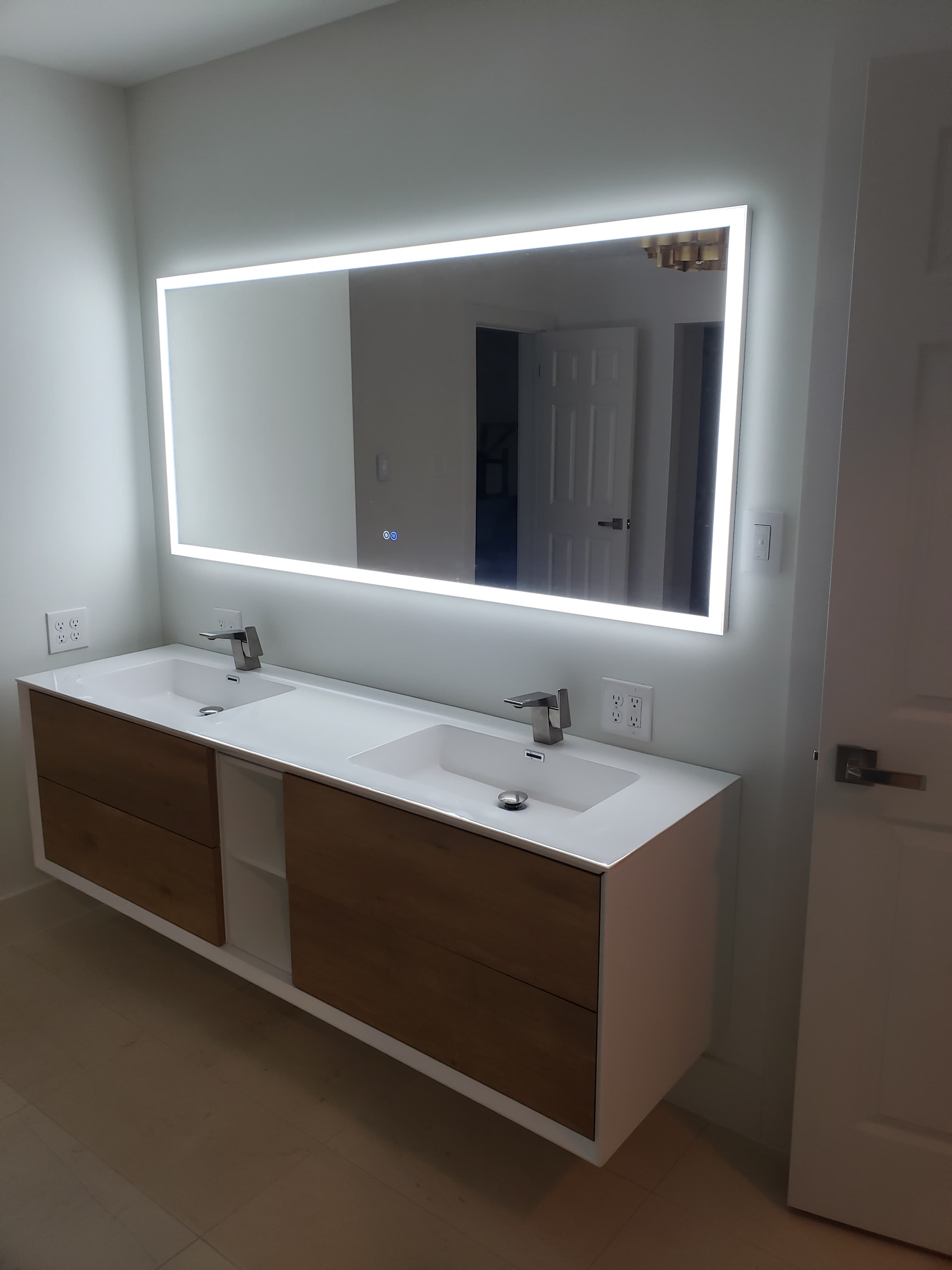 Modern bathroom renovation with floating vanity and dual sinks San Antonio