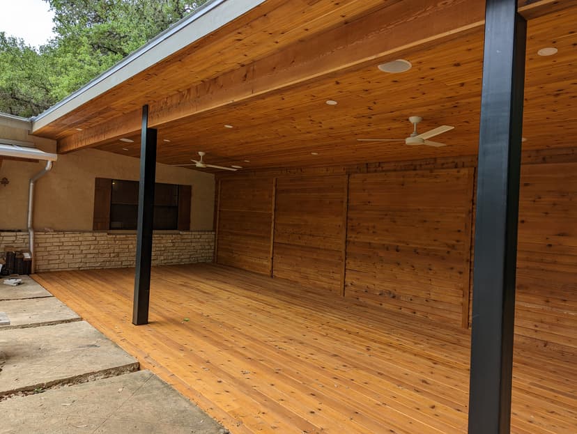 Deck with pergola and outdoor kitchen in Boerne